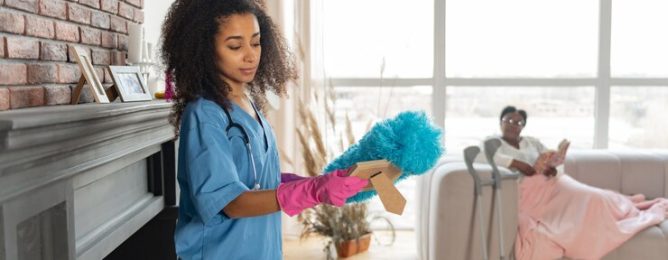 after-dusting-curly-young-private-nurse-wearing-pink-gloves-looking-photo-after-dusting-room_259150-46789